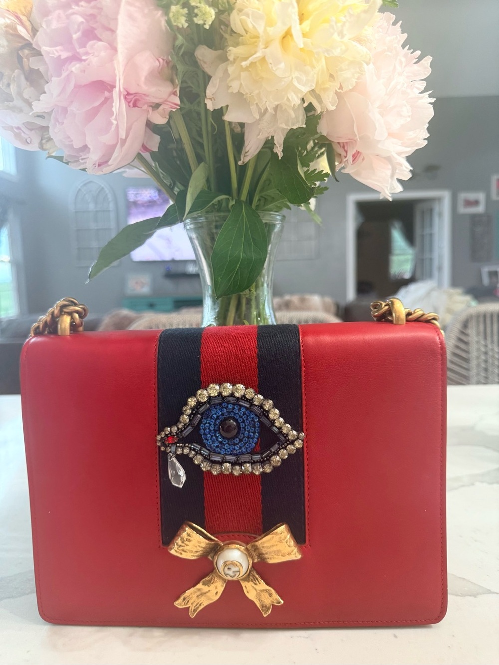 GUCCI……Red Leather Shoulder Bag with Embellished Evil Eye and Gold Bow